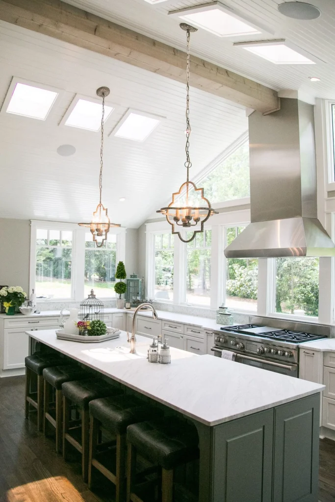 These beautiful, matching pendant lights above the island add the